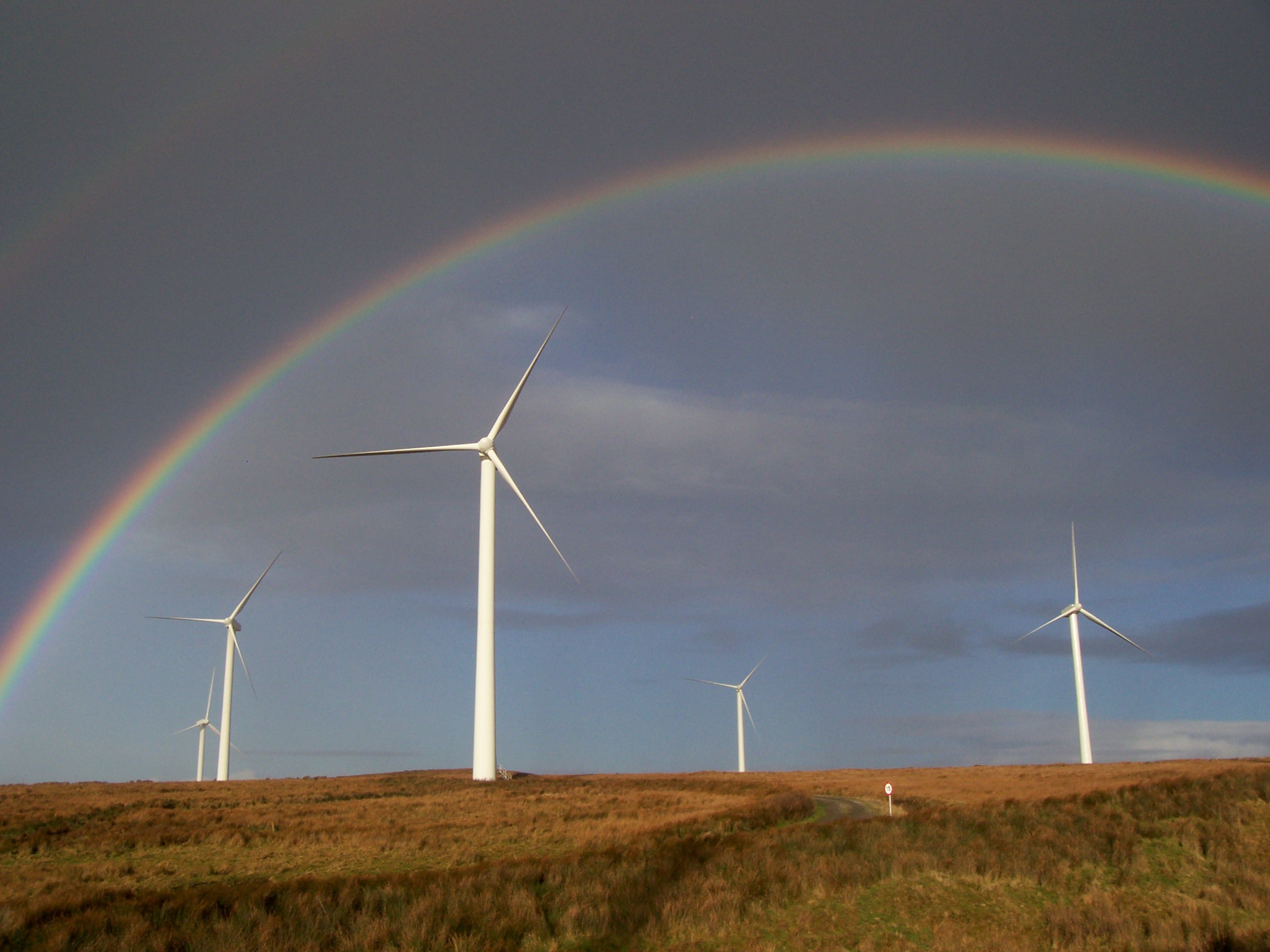 Wind turbine A rainbow over wind turbines.
