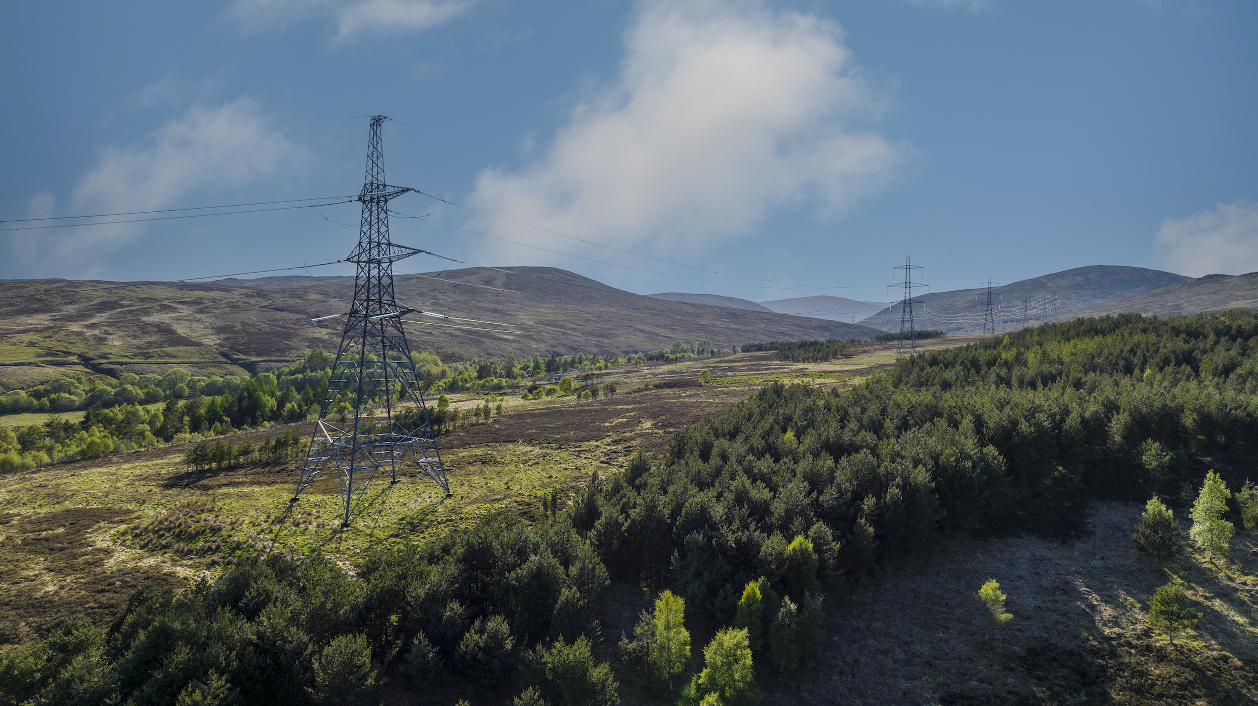 Towers running along snowy moutainside