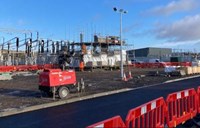 Substation infrastructure surrounded by scaffolding.