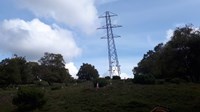 Metal lattice tower slightly tilted