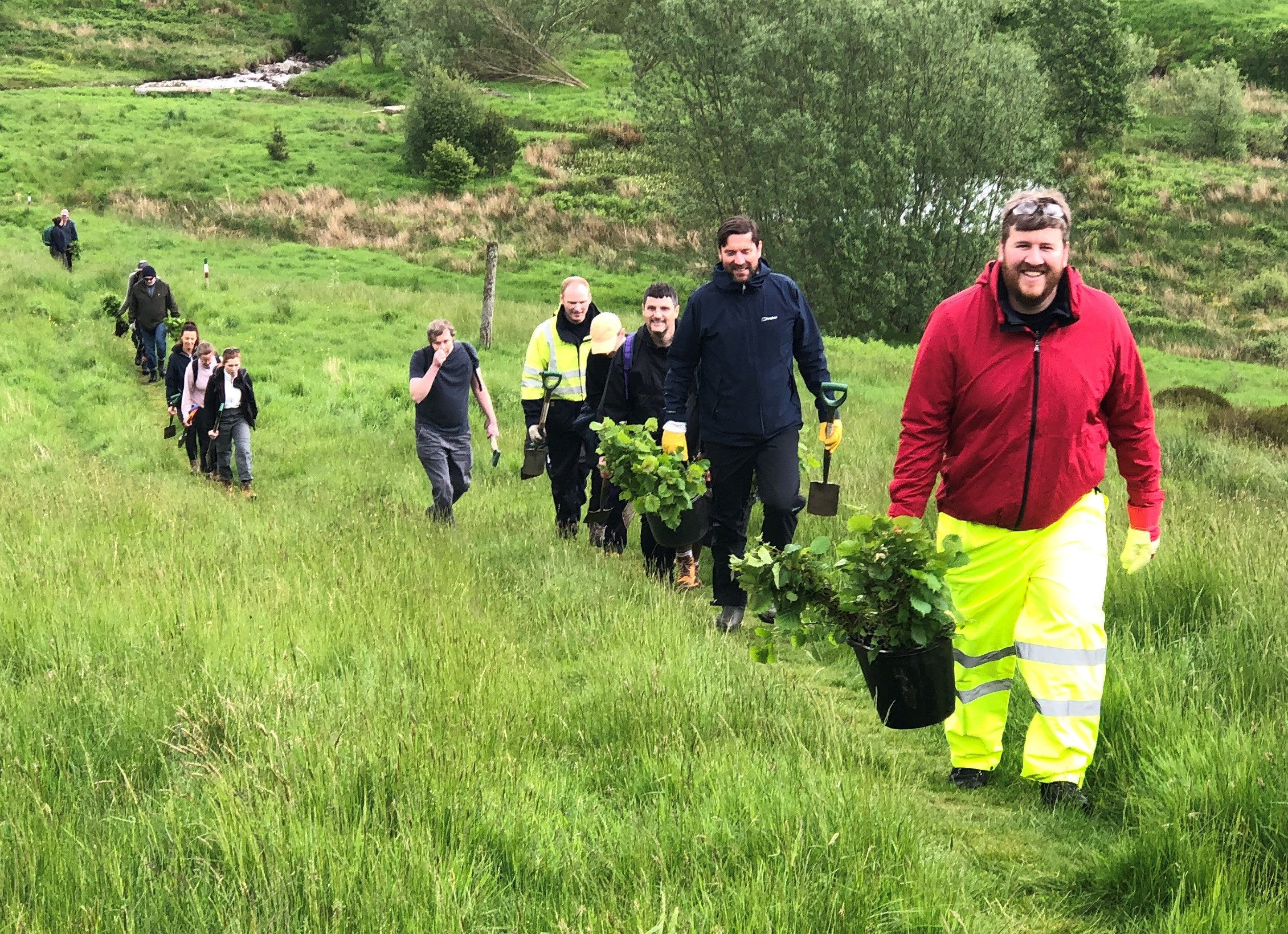 13 volunteers got involved to help plant native tree species at Dun Coillich