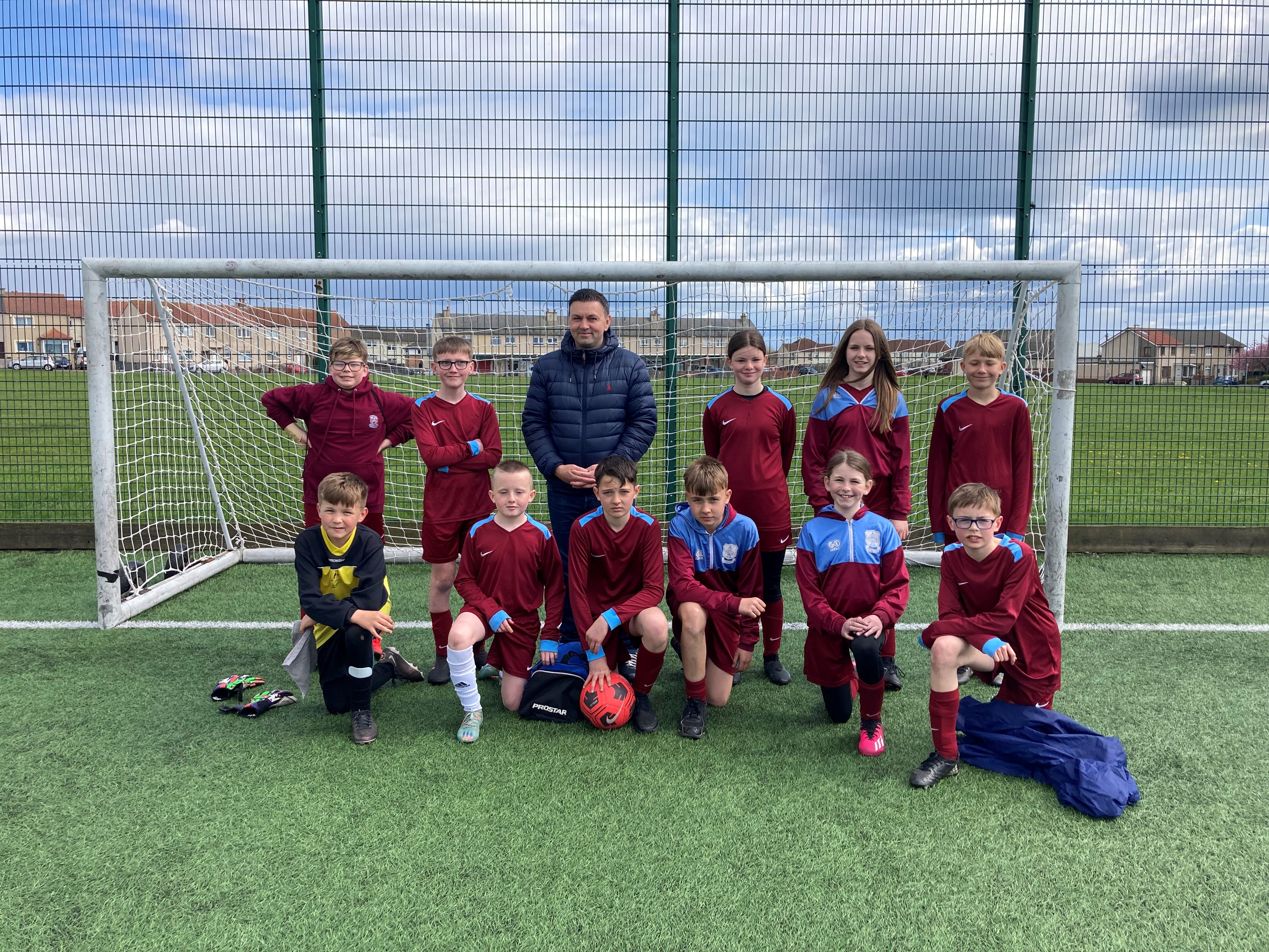 4_SSEN Transmission_Site Supervisor Paul Munn volunteered to help coach a primary school football team in a local football tournament.jpg